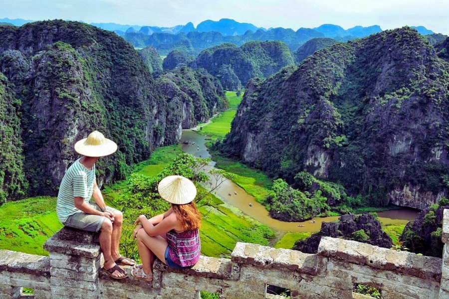 Travelers enjoying scenic Tam Coc viewpoint in Ninh Binh, Vietnam – Auasia Travel